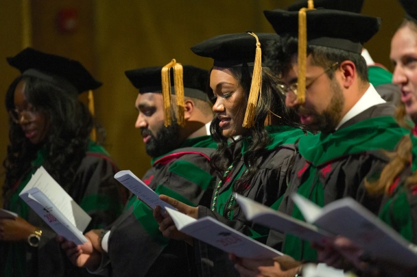 Students recite the physician's oath during convocation